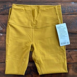 Lululemon gold wunder train HR tight 25” size 6